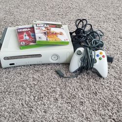 xbox 360 with two games, controller, and all connecting cords in working order