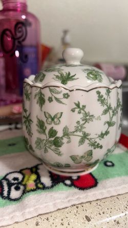 green and white sugar jar