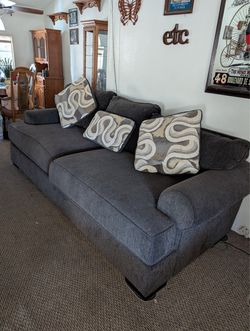 Beautiful bluish grey couch.