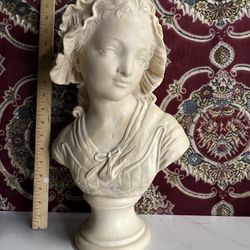 bust of a young girl in a bonnet, after the model by Grinam Niam incised Paris / Grinam Niam