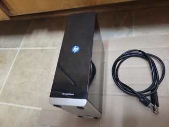 The HP SimpleSave MD1000H is a 1TB, 3.5-inch desktop external hard drive (7200 RPM) using a USB 2.0 interface for automated file backup. Released arou