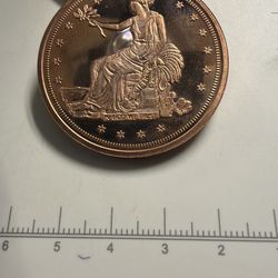 1 oz copper round with the Trade Dollar design