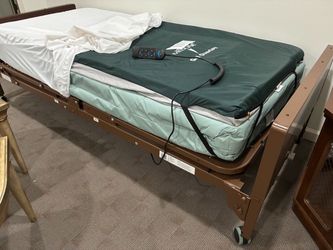 Electronic hospital bed. Excellent condition. Mattress, gel pad, side rails.