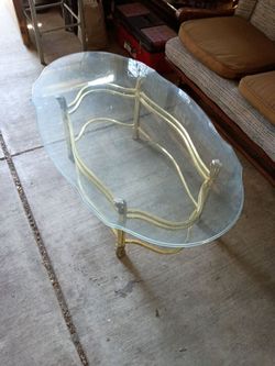 Brass and glass coffee table/48 x 27 x 16 inches