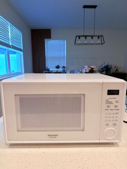 Selling a white Sharp 31-liter microwave.