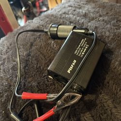 PiSFAU 150W car power inverter that converts DC 12V vehicle power to 110V AC household power. 