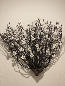 2’ x 2’ twig wall decor with white metal flowers.
