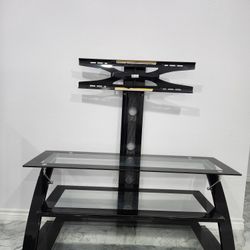 Glass Television Stand for TVs up to 70" inches. Great condition no damages. Black.