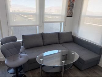 Sofa w/ 2 high chairs and coffee table.