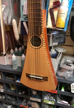Slim travel guitar like a Martin backpacker guitar new with hard case