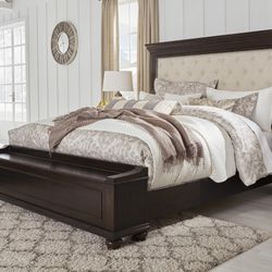 Brynhurst Dark Brown Queen Upholstered Storage Bed

