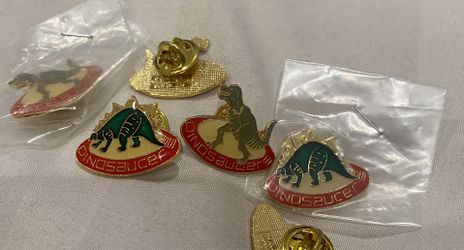 Rare collectible Vintage 1987 Dinosaucer Lapel Pin. Coca Cola Telecommunications 1987 Printed on the back. Brand new in original sealed bag. Multiples