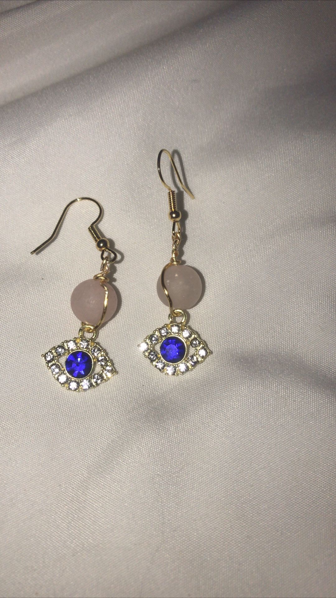 Rose quartz and eye pendant earrings