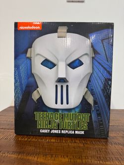 The official NECA Teenage Mutant Ninja Turtles (1990 Movie) Casey Jones Mask Prop Replica in its packaging.