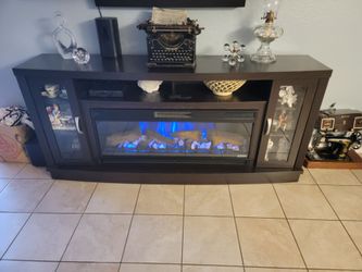 Fireplace and TV stand. Electric  with remote control.