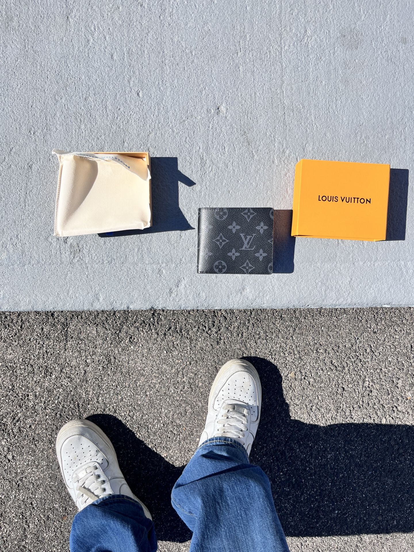 Louis Vuitton black monogram wallet.