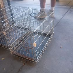 Metal Wire Dog Crate with Tray. The measurements are around 12 in x 24 in. 2 for $40 or $25 each.
