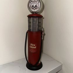 decorative replica of a vintage "Fire Chief" gas pump, featuring the iconic Route 66 logo 