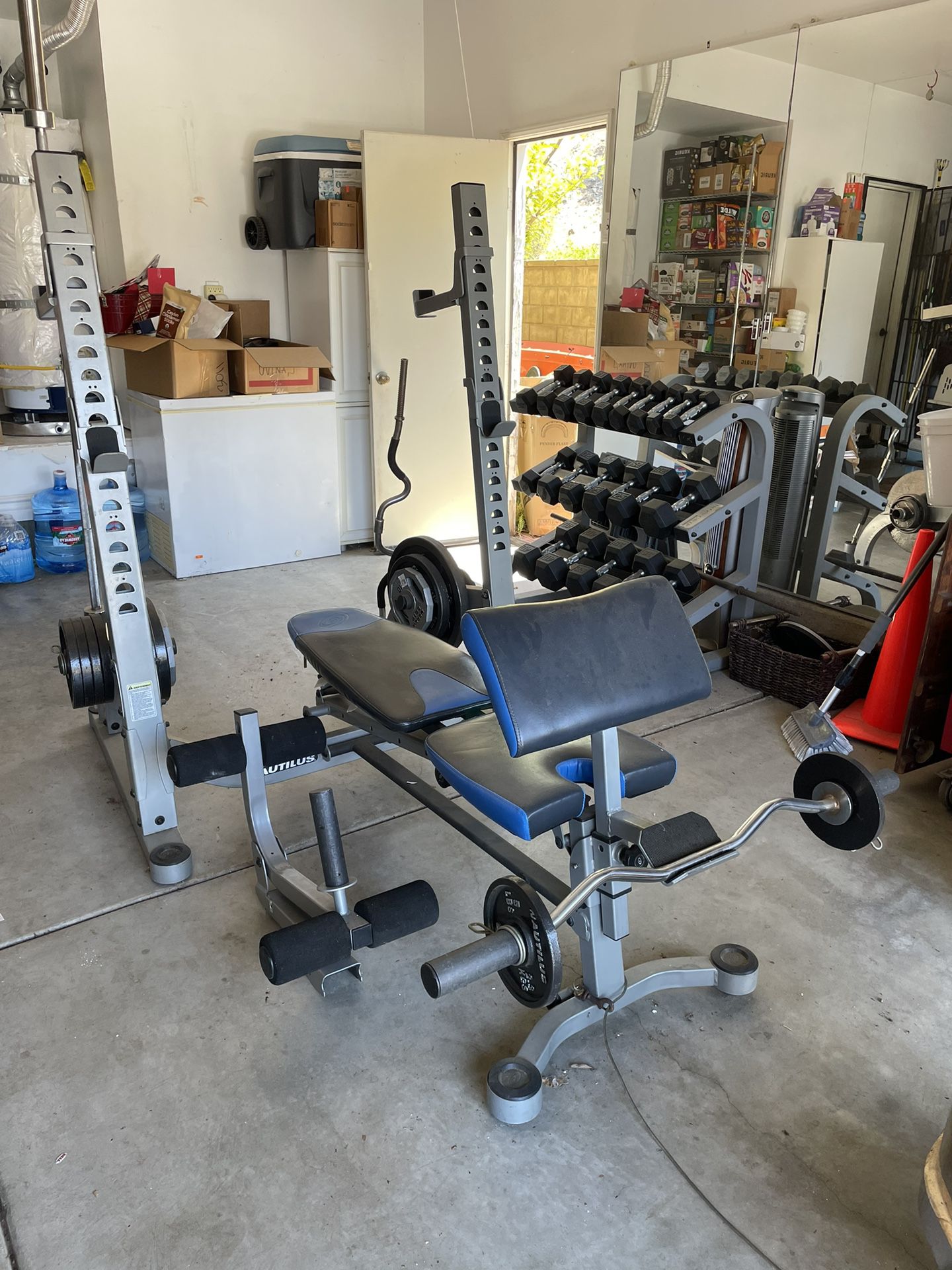 Dumbbell set, Nautilus Weight bench Set, And mirrors