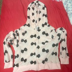 Pink fuzzy zip up with black bows
