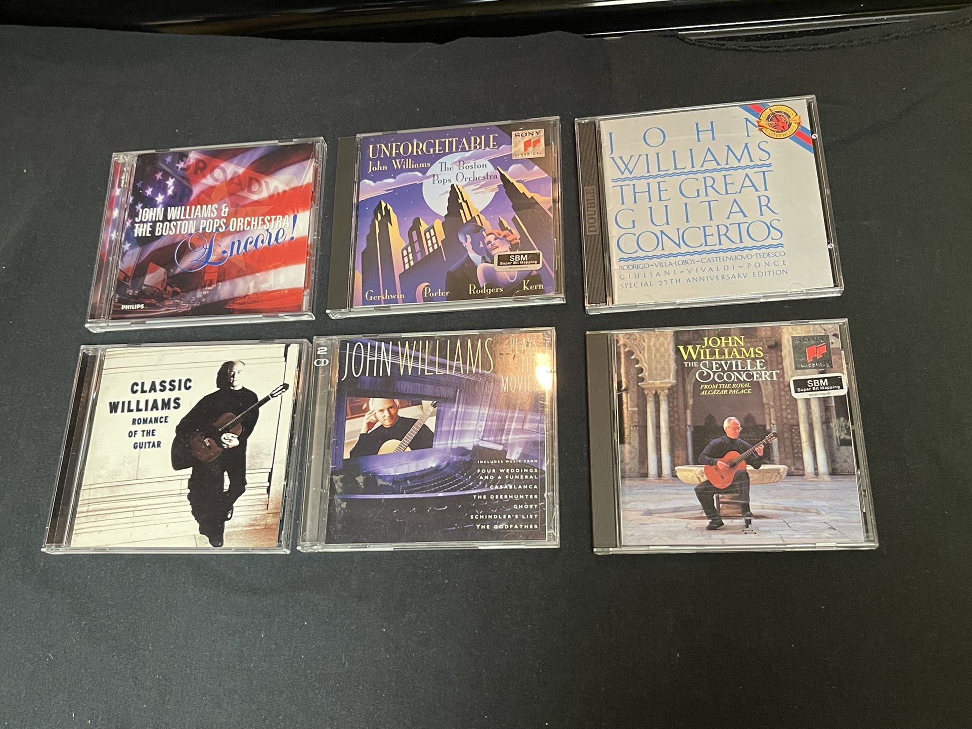 Lot of six audio CDs by John Williams guitar concertos And Boston pop