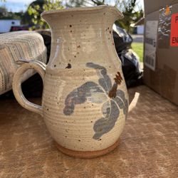 Pitcher with flowers on it