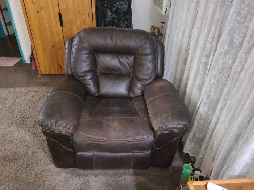 A brown.
Recliner, rocking chair.