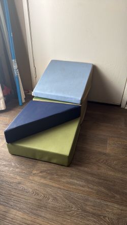 Toddlers climbing blocks