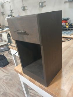 Brown stained bedside table