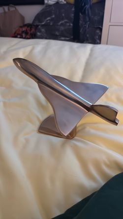 Plane brass figurine.