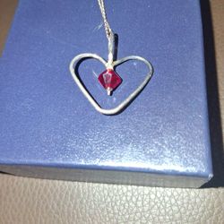 Sterling Silver  Heart With Red Garnet Like Center Stone 
