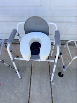 Commode with elevated cushion seat