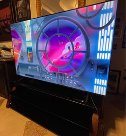 76 Inch TCL TV w/Remote & Smoked High End Glass Stand