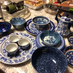 6 plates 5 diff bowls 3 tea cups and tea kettle all together 16 pieces