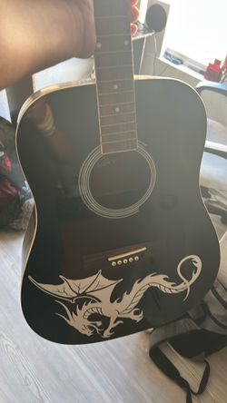 An getar but needs repair to it but just needs loving