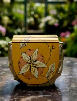 vintage handcrafted straw marquetry evening bag, an elegant accessory characterized by its shimmering, reflective gold surface. Straw marquetry is a h