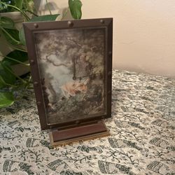 ANTIQUE .... REDUCED!! LUXOR brass/bronze clock. Beautifully detailed painting and the man pushing a woman on the swing