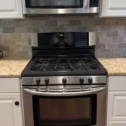 Kenmore elite range and matching over the stove microwave