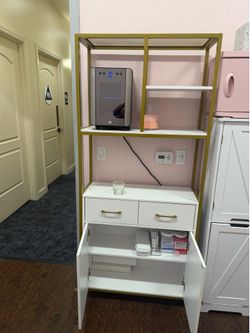 Gold and white cabinet