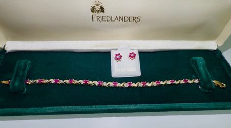 Women’s gold bracelet and earrings