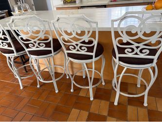 4 Heavy duty white bar stools with intricate backing