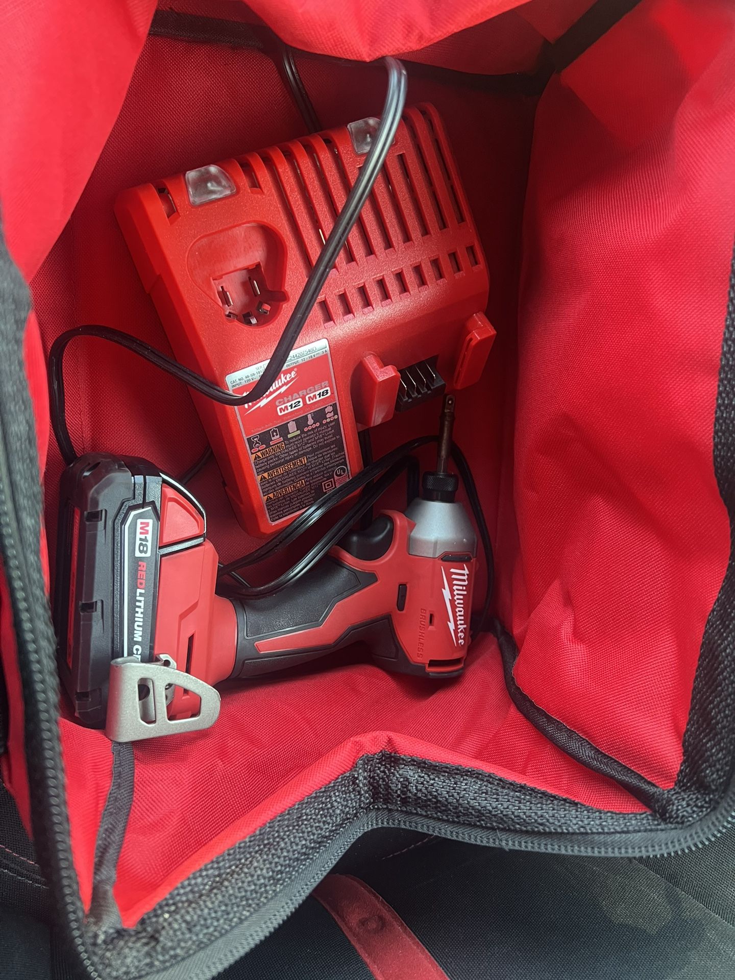 Milwaukee M18 Brushless 1/4 Driver Impact Toolbag With Charger And Battery
