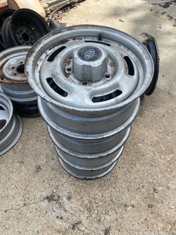 Kia wheels 15X6JJ with center caps set of 4.