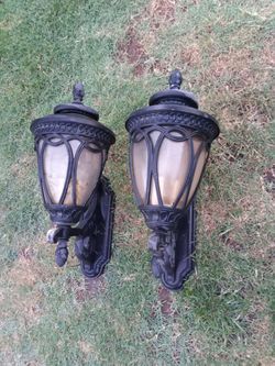 A pair of matching black garage outdoor lights