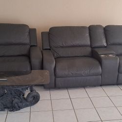 Two Reclining Couches With Coffee Table