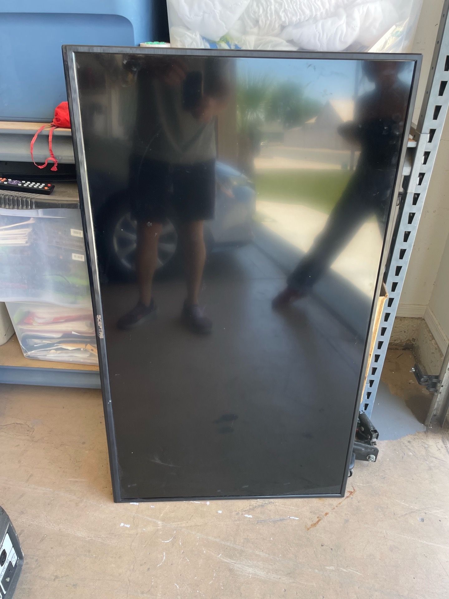 52 inch TV with a remote control