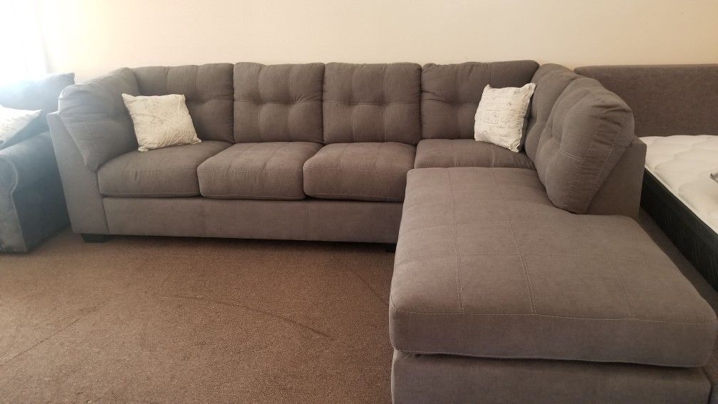 Ashley name brand sectional new. Grey. $0 down available
