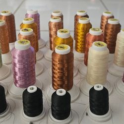 Spools of metallic embroidery threads . Total $35