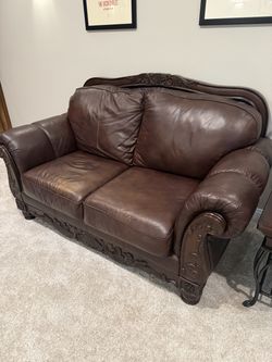 Ashley North Shore Plus Leather Loveseat – Brown