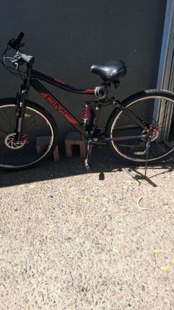 GMC Canyon dual shock mountain bike, black with red writing 29" tires disc brakes